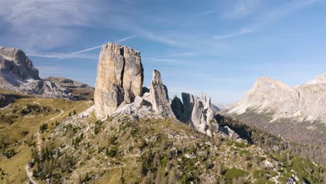 drone flies away from cinque torri rock formation