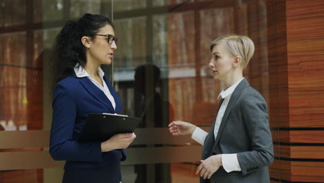 businesswomen in conversation