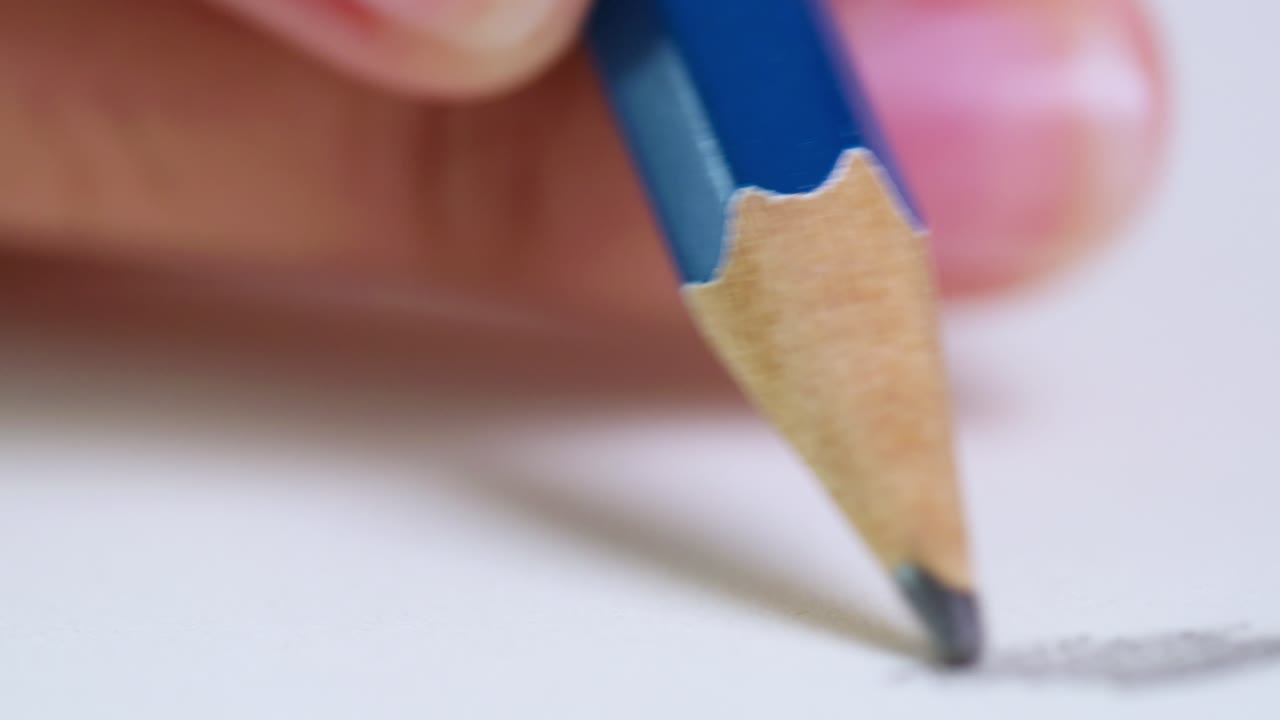 A close-up of an artist sketching with a pencil showcasing creativity and focus