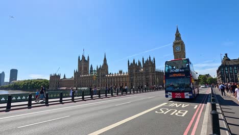 bus moves past big ben in london