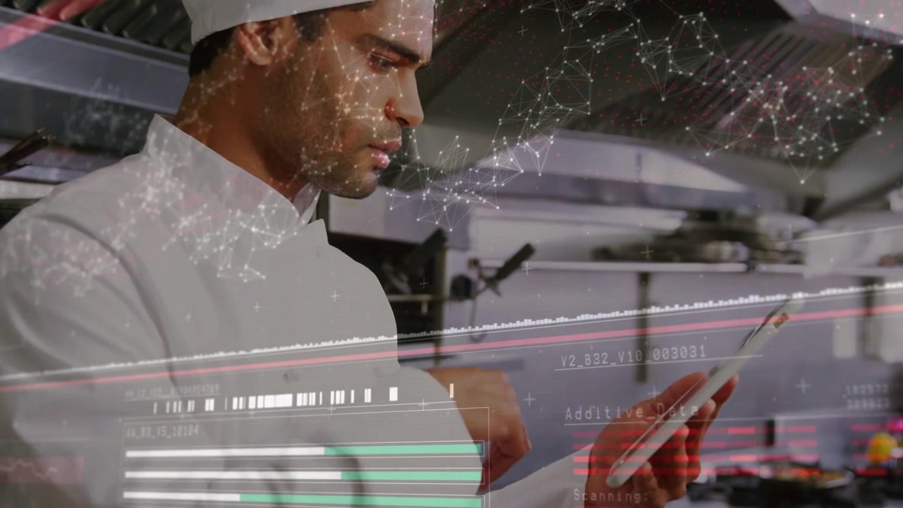 Male chef tapping tablet and causing faint data HUD to update while monitoring kitchen operations