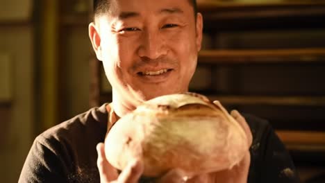 master baker proudly presents his artisanal loaf: a celebration of craftsmanship and passion in every slice for bread enthusiasts everywhere