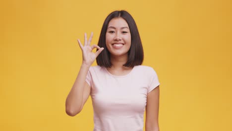 happy woman making an ok gesture