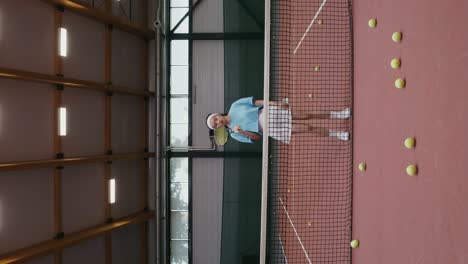 woman playing tennis inside an indoor court