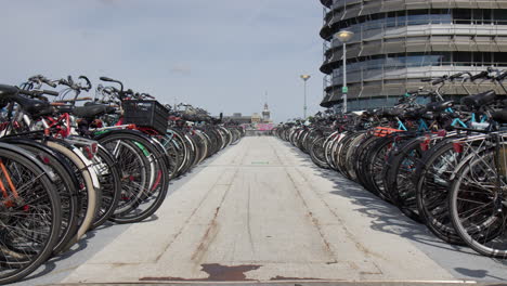 bikes at the bike parking space in amsterdam, netherlands - wide shot