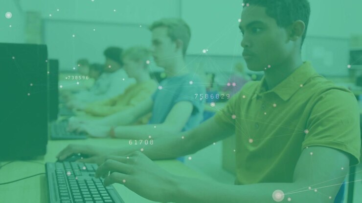 Students entering lab taking seats while practicing typing with data overlay highlighting keys