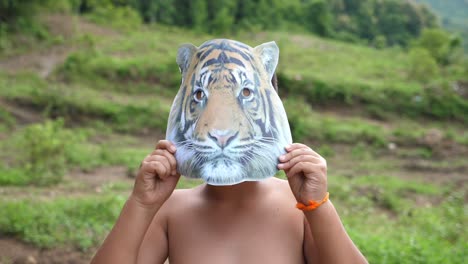 asian boy wearing animal masks