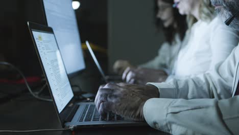 cropped short of teleworkers using laptops