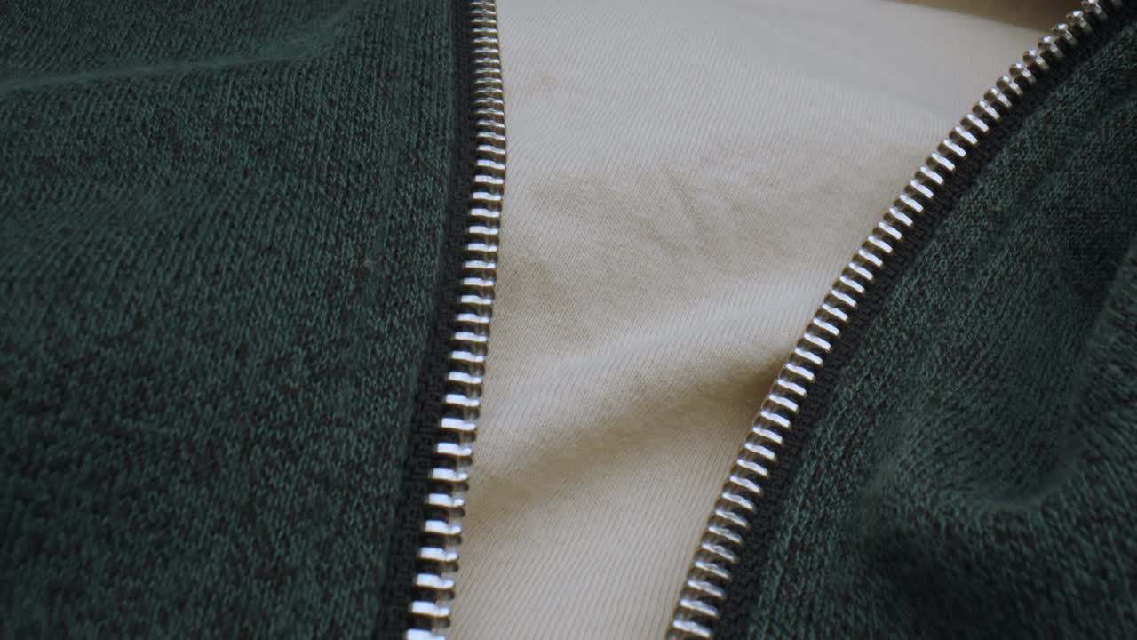 Zipper of black sweater in macro view with probe lens