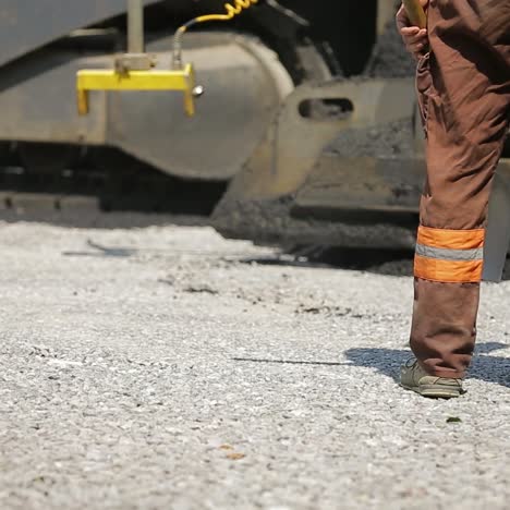 laying asphalt with road construction
