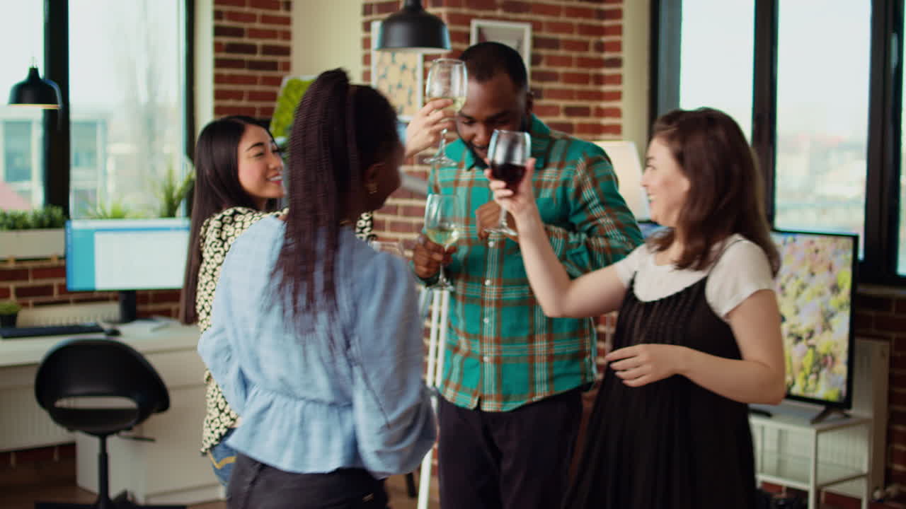 Energetic group of friends dancing at apartment party, having fun together