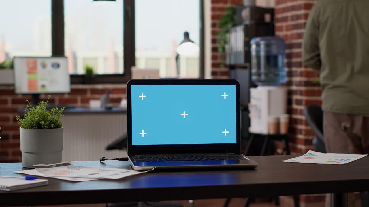 Corporate office with business people working with greenscreen