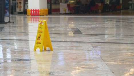 wet floor sign in a shopping mall