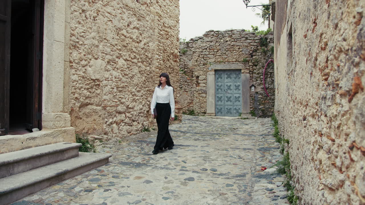 Young Woman Arriving At The Church With The Bible In Her Hands