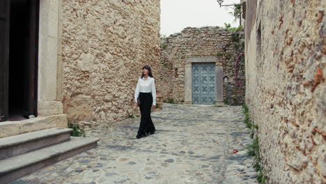 young woman arriving at the church with the bible in her hands