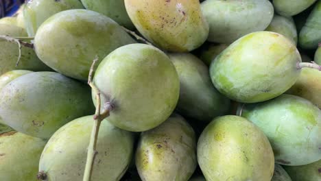 large plentiful fresh mangoes at the market