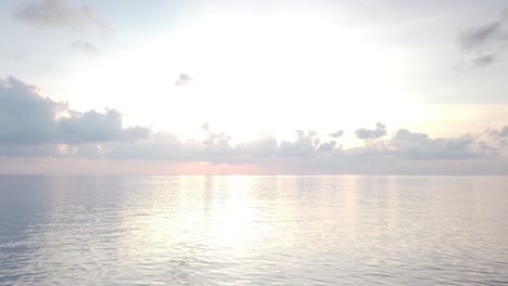 Tracking-Shot-of-Ocean-Waves-at-Dawn-off-the-Coast-of-Little-Andaman,-Andaman-Islands,-India