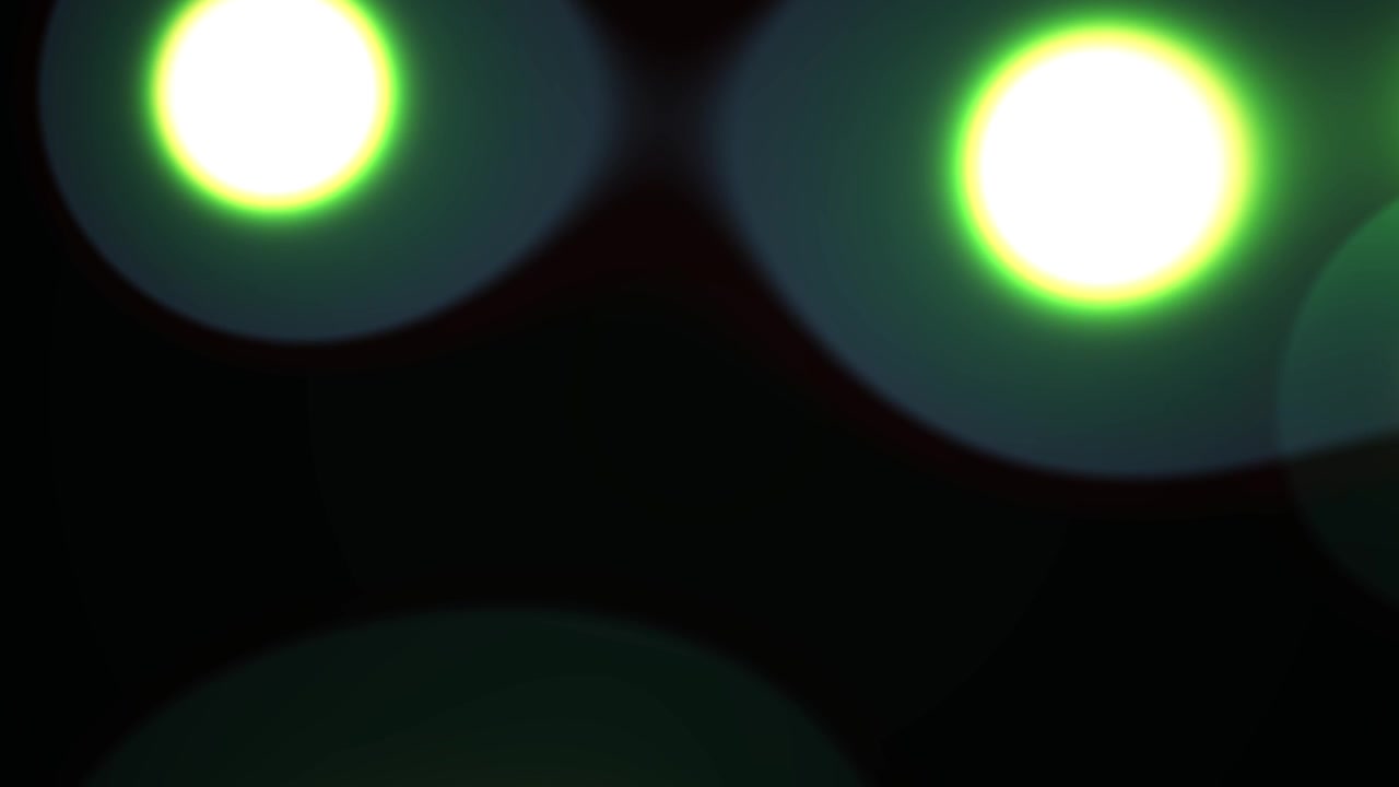 Abstract Glowing Circles Moving and Merging on Black Background