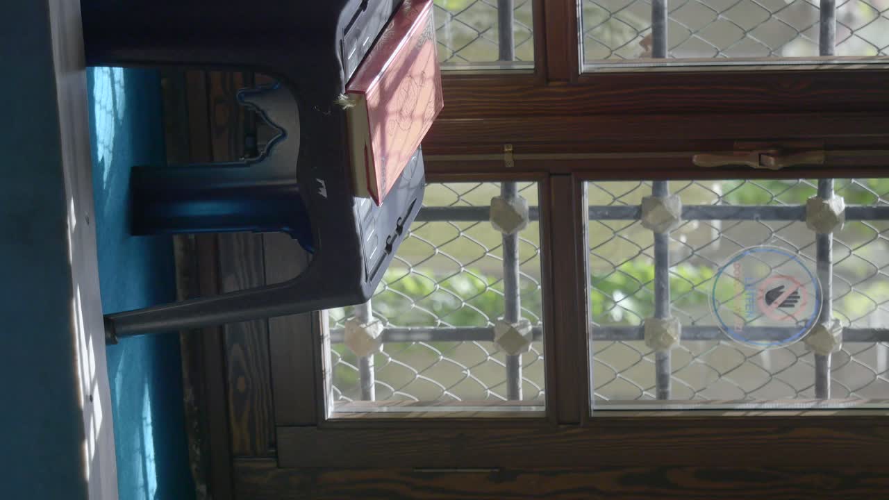 Interior View of a Room with a Chair and Book