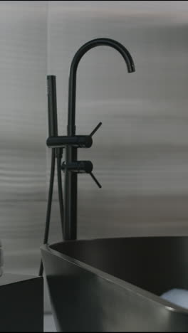 modern black bathroom with tub and shower