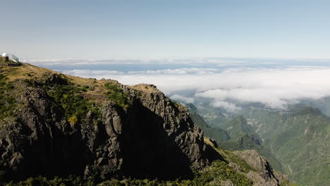 amazing view on the mountain peaks from pico do arieiro on portuguese island of madeira - aerial drone shot