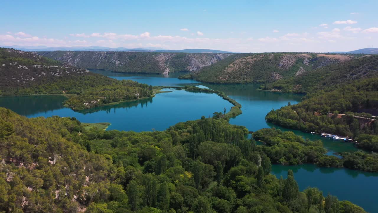 Stunning aerial view flying forward across Krka National Park lakes and waterfalls in Dalmatia, Croatia filmed in 4k