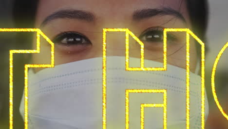 animation of yellow neon words stay at home over asian woman wearing covid19 mask