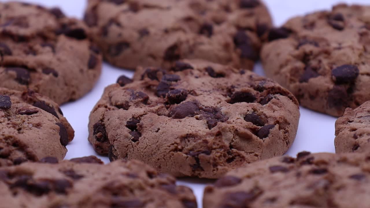 Cookies with chocolate chips rotating on a turntable