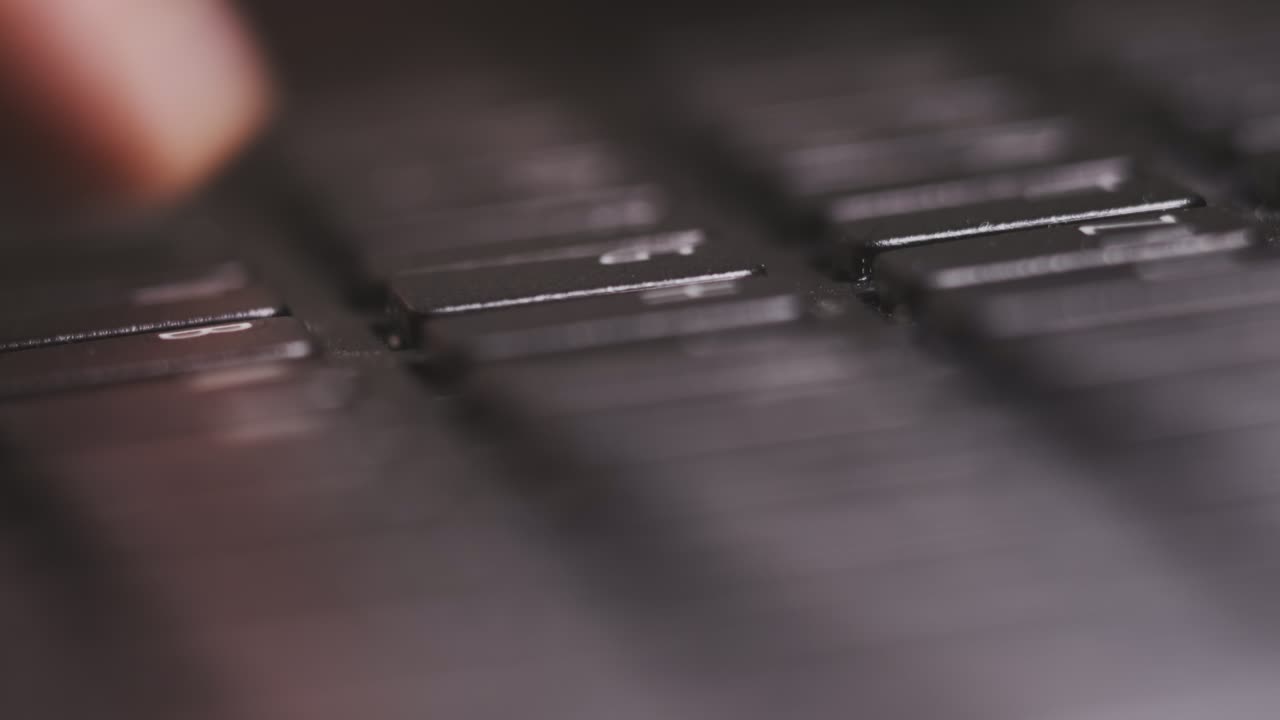 Freelancer types text on laptop writing report of done work