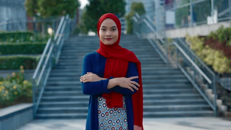portrait of a young muslim woman in a hijab standing outdoors