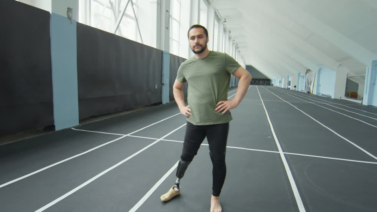 Man with Prosthetic Leg Warming Up before Training