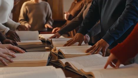 group of people studying and reading books together