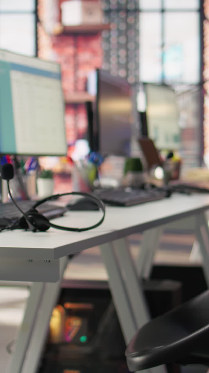 Vertical video Audio equipment communication gear in customer center workspace, close up