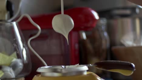 Close-up-slow-motion-of-cake-pop-with-melted-white-chocolate