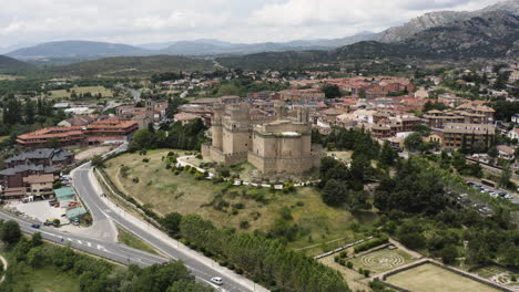 Manzanares-el-Real-near-Madrid-in-Spain---Wide-aerial-shot-of-the-town-and-surrounding-landscapes-including-Cucenca-Alta-Regional-Park