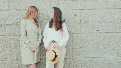 two women having a conversation outdoors