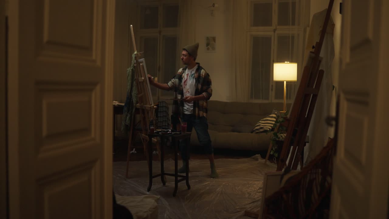 Artist Painting in Home Studio at Night