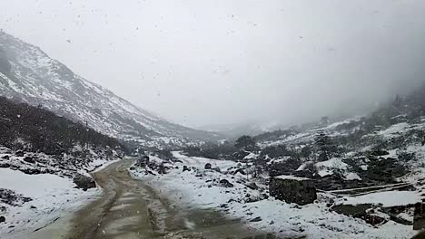 snowfall in himalayan snow cap mountains at morning