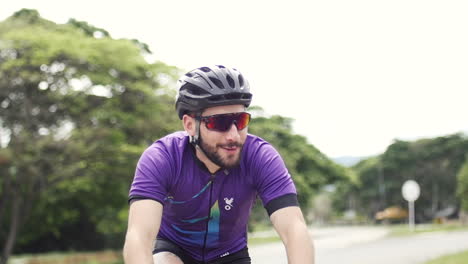 cyclist drives his bike with his girlfriend in a highway