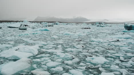 Slow-pan-of-misty-melting-glacier-lagoon