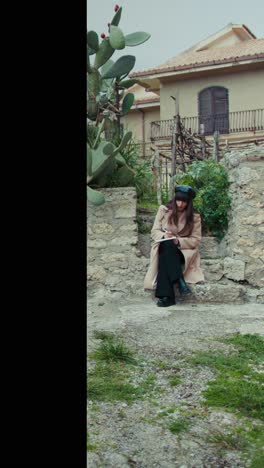 woman studying sitting in the town immersed in the nature