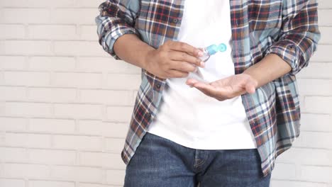 person applying hand sanitizer