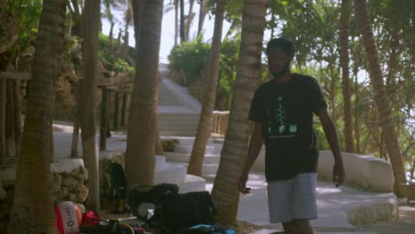 african man walking at the resort after scuba diving in kenya