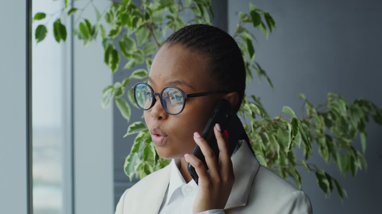 Businesswoman on Phone Call in Modern Office