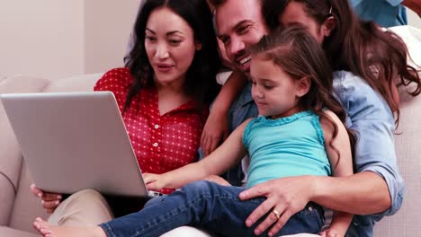happy family doing video chat on laptop
