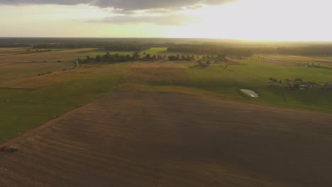 Agricultural-Fields-In-The-Evening-Illuminated-By-Sunset-Lights