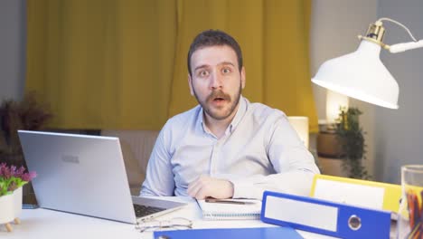 home office worker man looking at camera confused.
