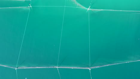 Net-Fishing-in-the-Aegean-Sea:-Aerial-View-of-a-Traditional-Trap-in-Thessaloniki's-Greece's-Deep-Blue-Waters