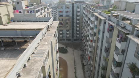 city walking path in tilting up view revealing city skyline, aerial drone