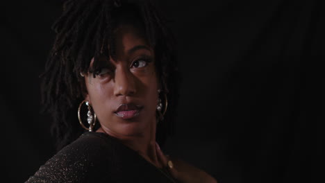 portrait shot of young sensual african american women with black background